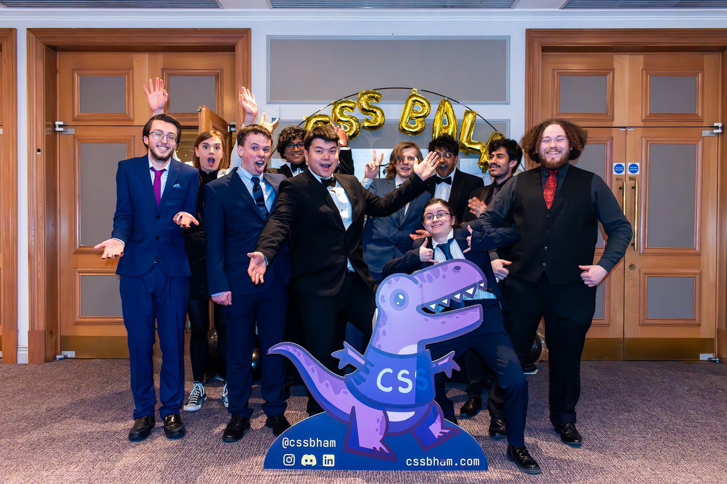 A photo of the CSS committee at the ball, all pulling funny faces.